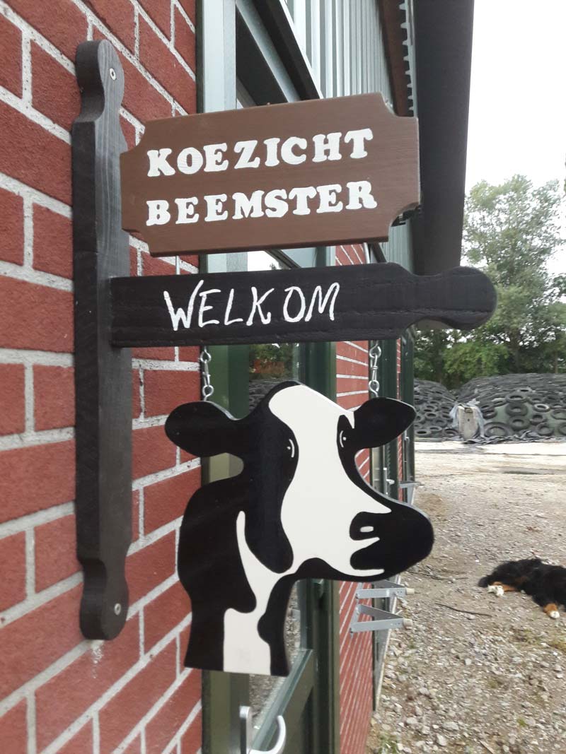 The ‘Koezicht Beemster’ sign with ‘Welcome’ on the front of the cowshed